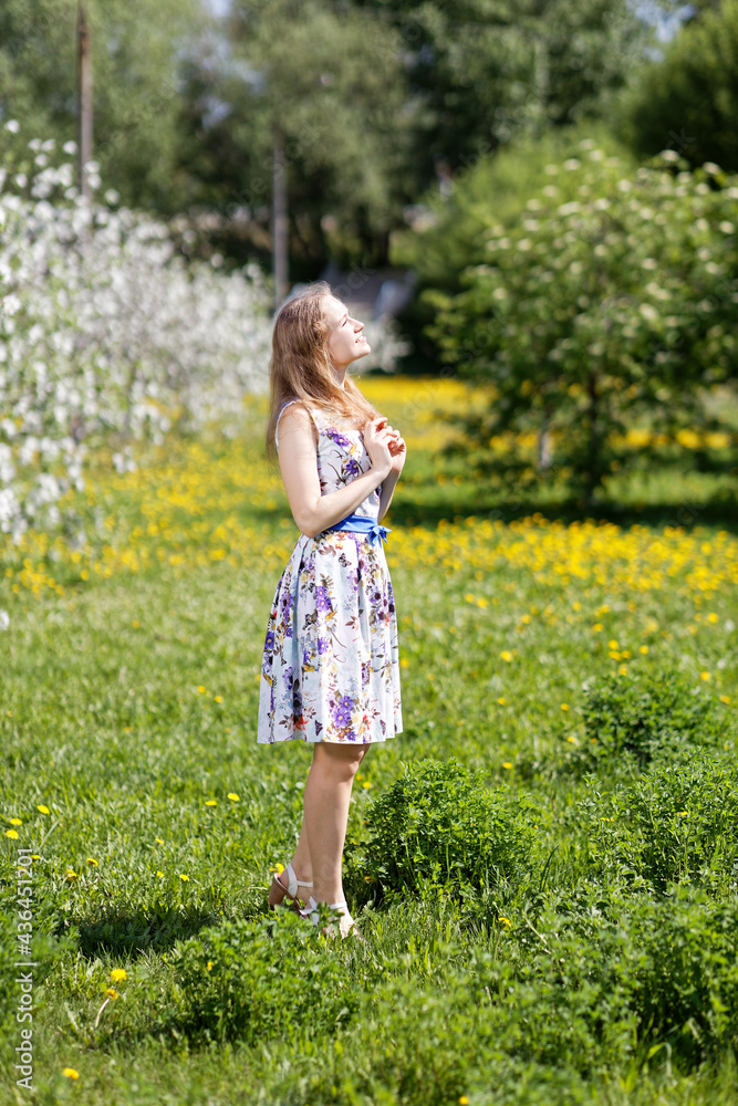 Portrait of a young woman on the nature blurred background. Shallow focus. Portrait of a young woman on the nature blurred background. Shallow focus.