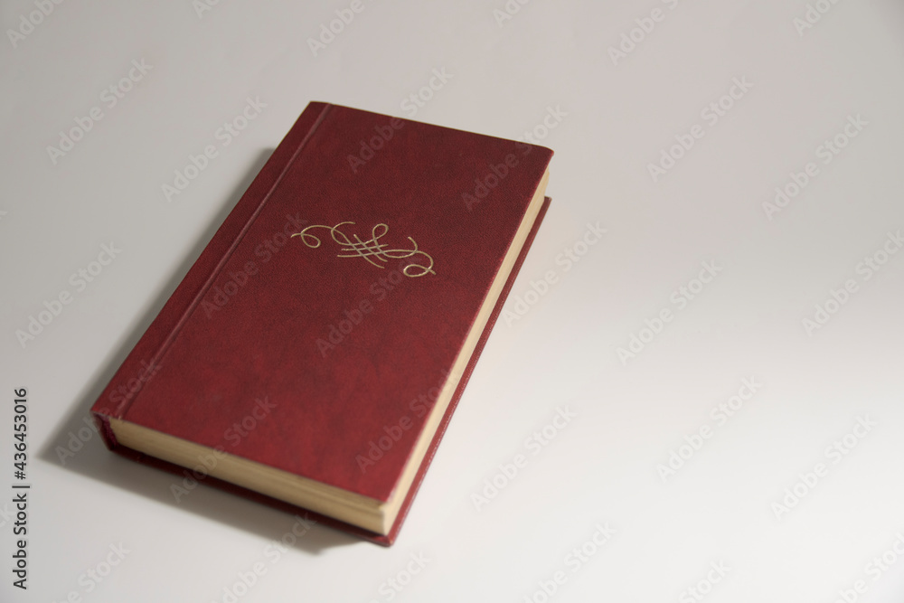 An old book with no title. Ornament or monogram and free space for title and text An old book with no title. Ornament or monogram and free space for title and text