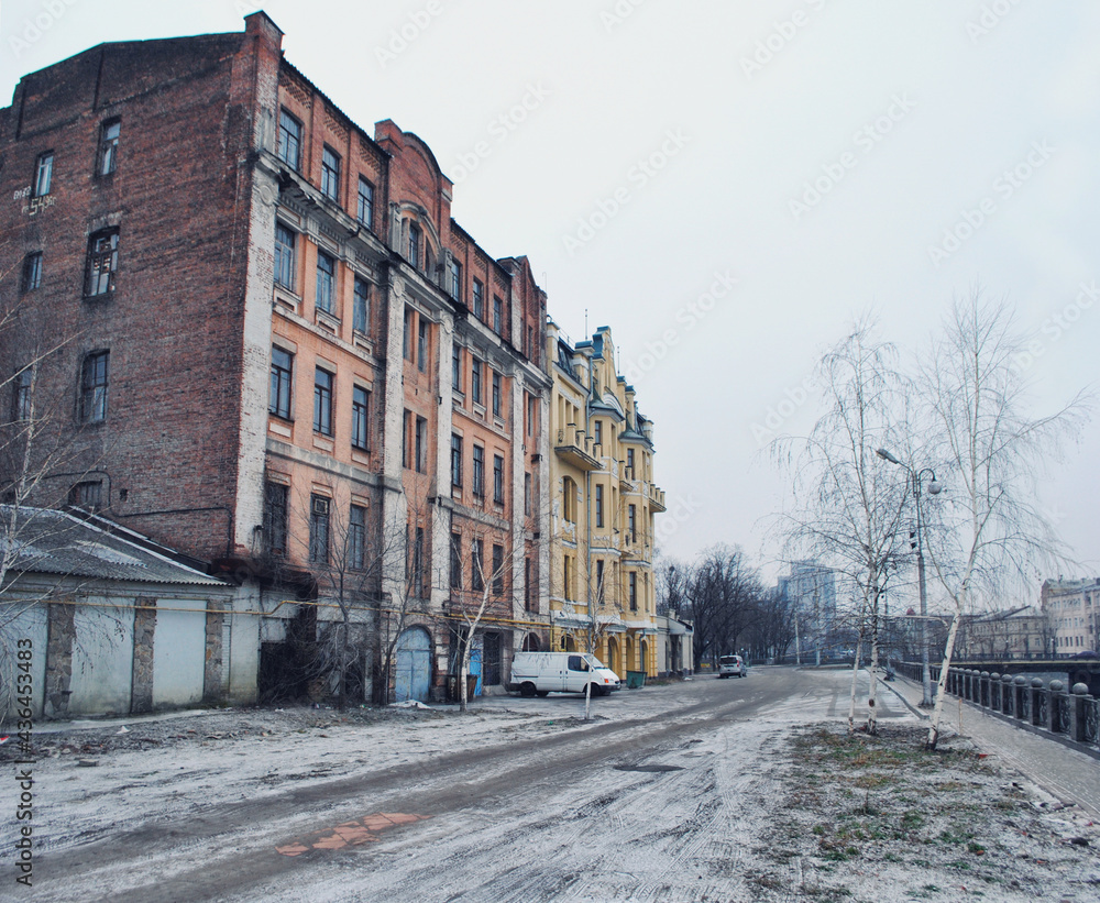 Old brick multi-storey building with narrow windows in Kharkov