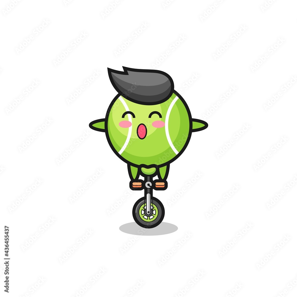 Obraz premium The cute tennis character is riding a circus bike