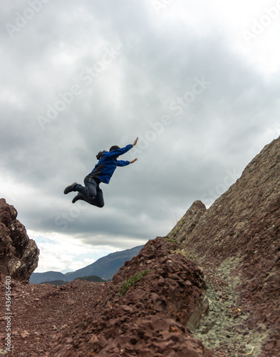 Person performing a jump of faith