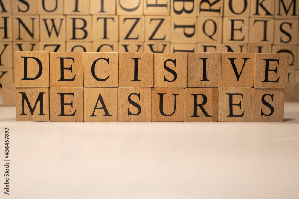 The word Decisive measures end was created from wooden cubes