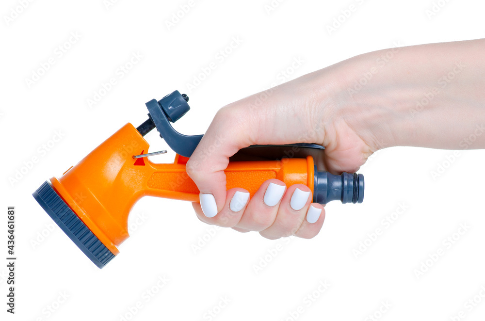 Garden hose sprayer in hand on white background isolation Garden hose sprayer in hand on white background isolation