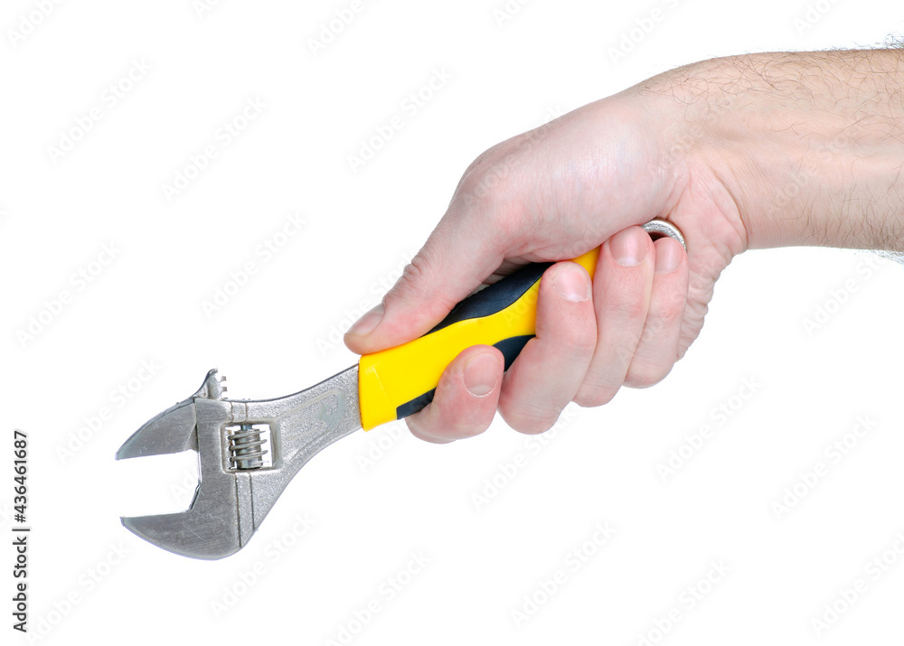 Adjustable wrench work tool in hand on white background isolation Adjustable wrench work tool in hand on white background isolation