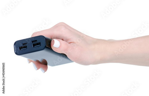 Black power bank in hand on white background isolation