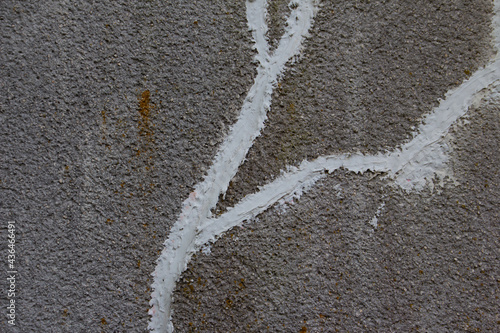 Obraz na płótnie Concrete wall with crack repaired with white concrete patching putty