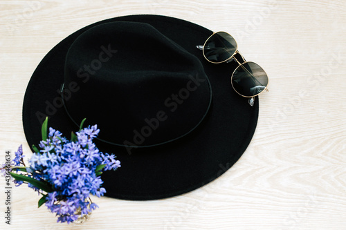 Flatley with black hat, glasses and flowers