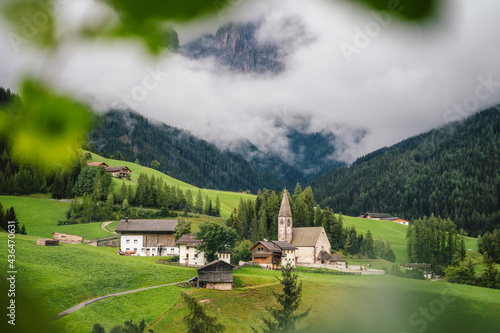 Santa Maddalena church in the Dolomites, Val di Funes, Italy, Europe. photo