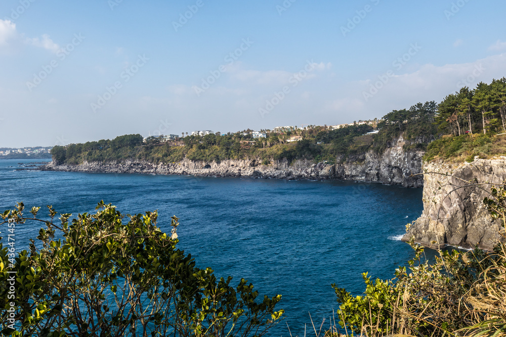 Naklejka premium The scenery of Jeju Island with blue sea and sky