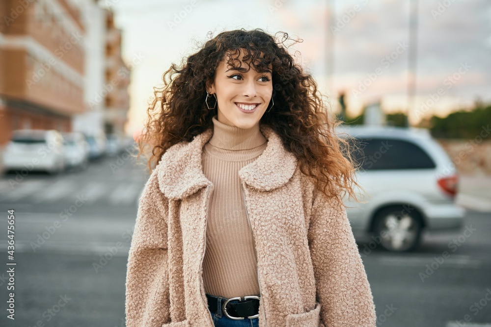 Young hispanic woman smiling happy standing at the city Young hispanic woman smiling happy standing at the city