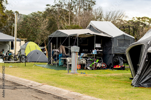 Camper trailers camping at the holiday caravan park. Family vacation travel concept photo