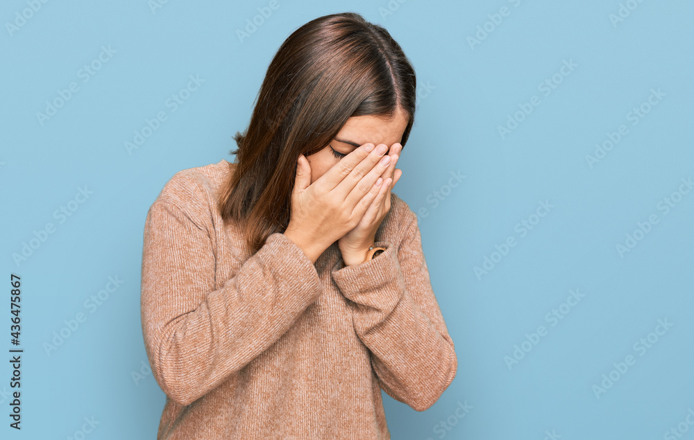Young beautiful woman wearing casual clothes with sad expression covering face with hands while crying. depression concept. Young beautiful woman wearing casual clothes with sad expression covering face with hands while crying. depression concept.