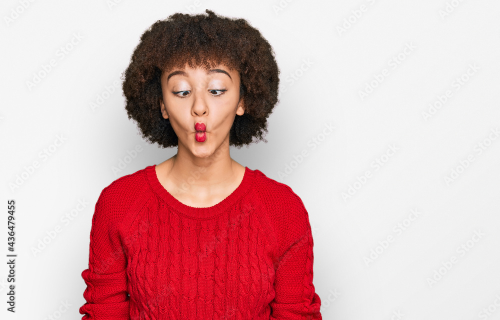 Young hispanic girl wearing casual clothes making fish face with lips, crazy and comical gesture. funny expression. Young hispanic girl wearing casual clothes making fish face with lips, crazy and comical gesture. funny expression.