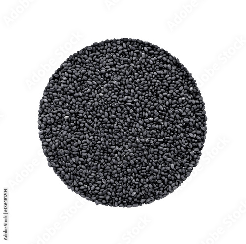 Isolate of a sample of small black seeds in the form of a circle. Agricultural seeds. Top view of seeds. © Vladislav