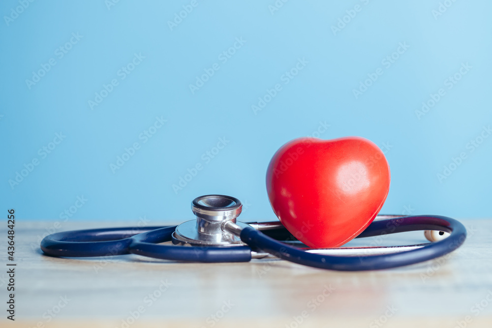 Stethoscope and a red heart. Concepts of a physical examination and Insurance health live concept. Stethoscope and a red heart. Concepts of a physical examination and Insurance health live concept.