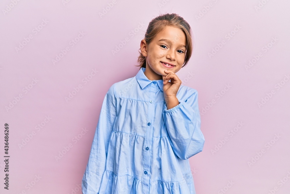 Little beautiful girl wearing casual clothes smiling looking confident at the camera with crossed arms and hand on chin. thinking positive. Little beautiful girl wearing casual clothes smiling looking confident at the camera with crossed arms and hand on chin. thinking positive.