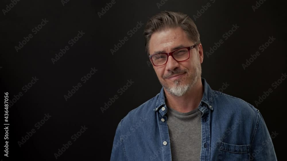 Portrait of mature age, middle age, mid adult man in 50s, happy confident smile. Pointing, saying yes. Copyspace. Portrait of mature age, middle age, mid adult man in 50s, happy confident smile. Pointing, saying yes. Copyspace.