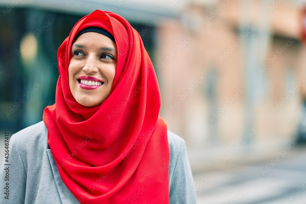 Young arab woman wearing hijab smiling happy at the city. Young arab woman wearing hijab smiling happy at the city.