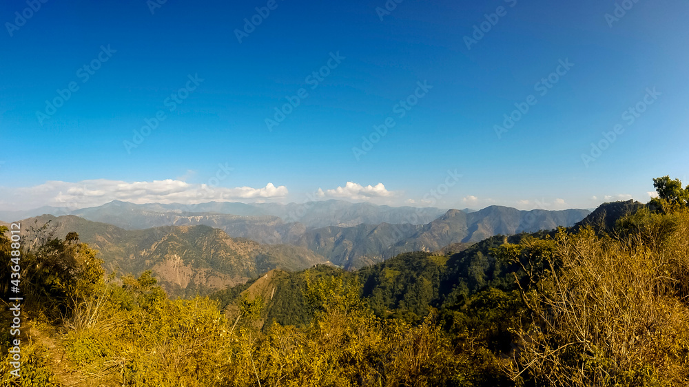 panoramic shot in Himalayas mountains with clear blue sky