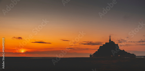 Panoramic view of the famous abbey of Le Mont Saint-Michel at sunset, Normandy, France