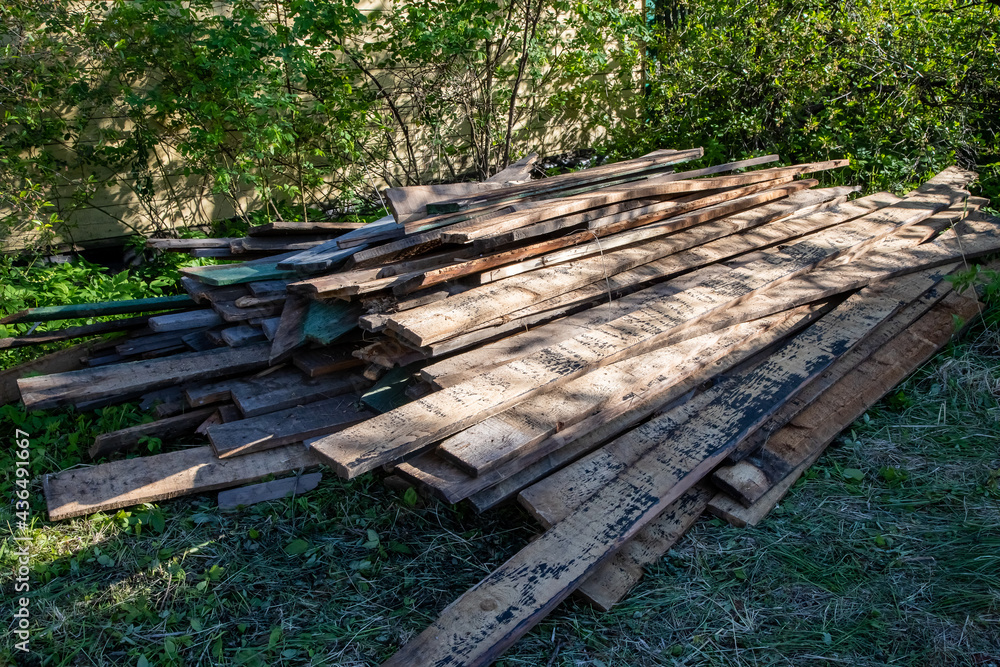a pile of old wooden planks