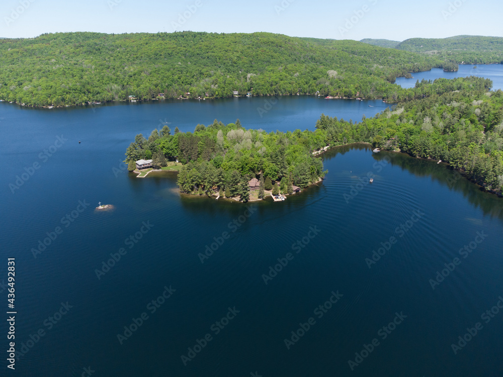 Drone aerial shot over Grand Lake in Val-des-Monts, QC, Canada