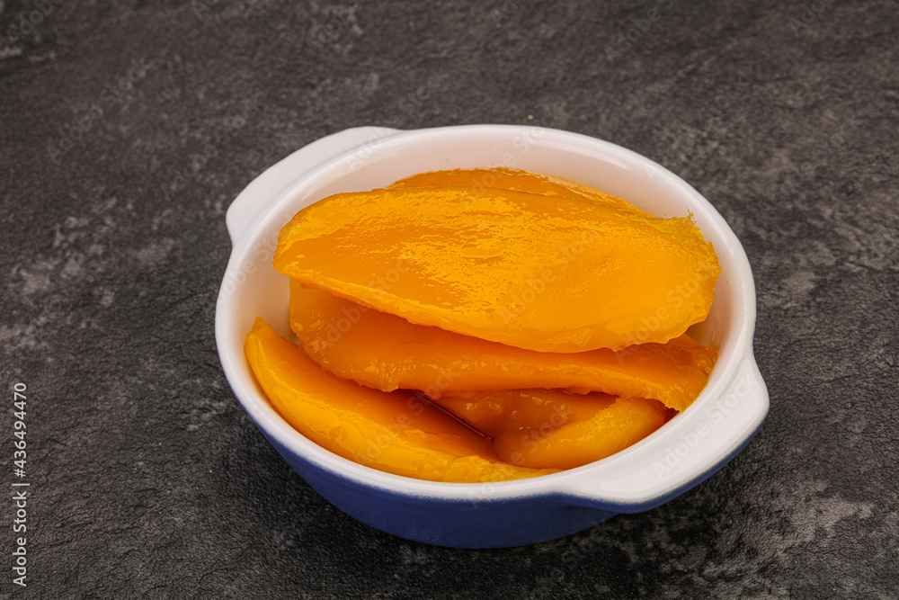 Sweet mango slices in syrop Sweet mango slices in syrop