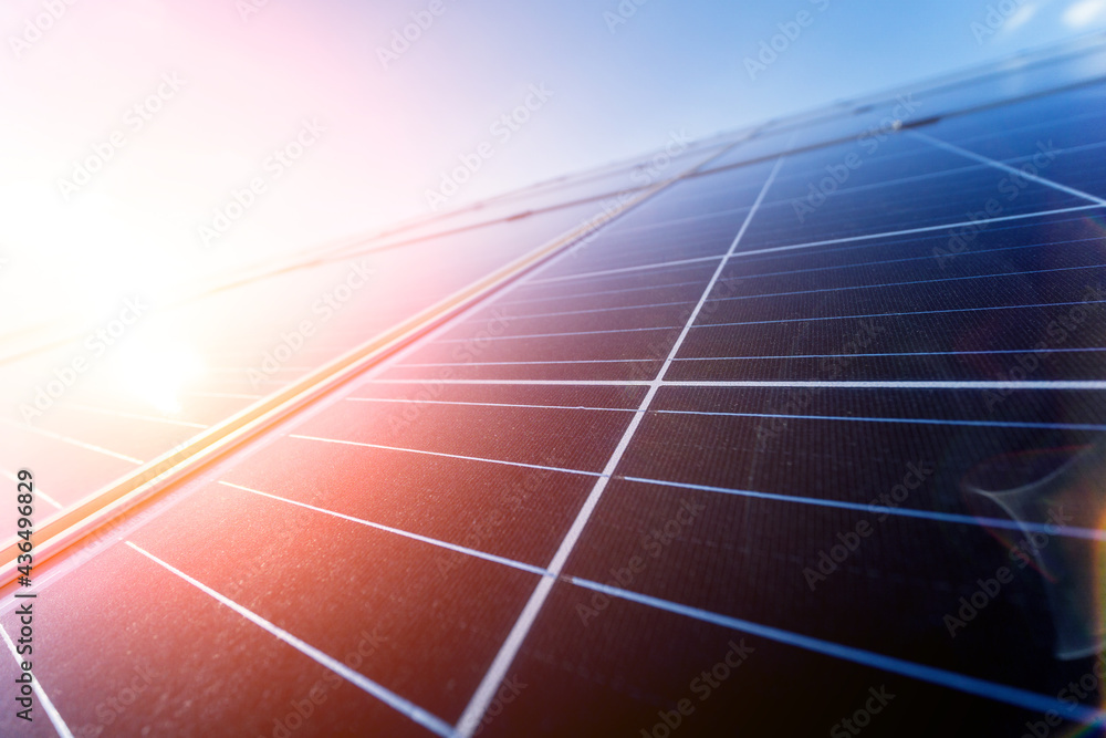 Photovoltaic solar panels on blue sky background
