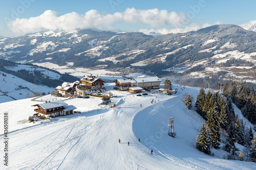 Elevated view of hotel and restaurant buildings  on the slopes at Kirchberg in Tirol, part of the Kitzbühel ski area in Austria.