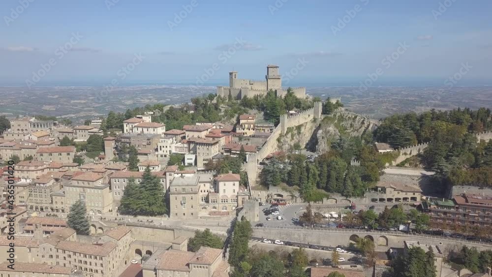 drone flying panoramic right around the city and san marino towers at the top of the mountain in Italy drone flying panoramic right around the city and san marino towers at the top of the mountain in Italy