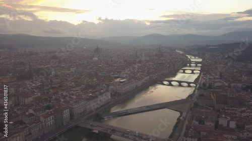 drone flying above the florence roofs, rivers and bridges with panoramic view