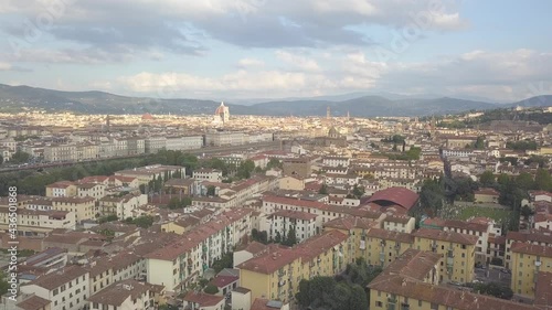 drone flying up above the florence roofs, rivers and bridges with panoramic view