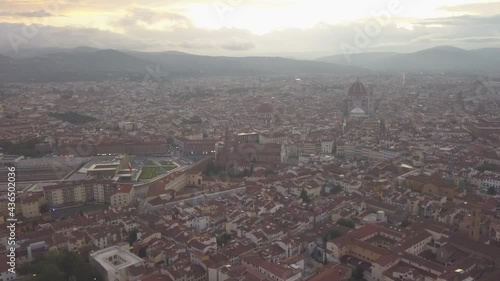 drone flying above the florence roofs, rivers and bridges with panoramic view