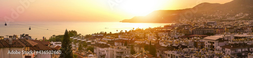 Принти на полотні Panoramic landscape - Alanya Turkey resort town in orange sunlight at sunset