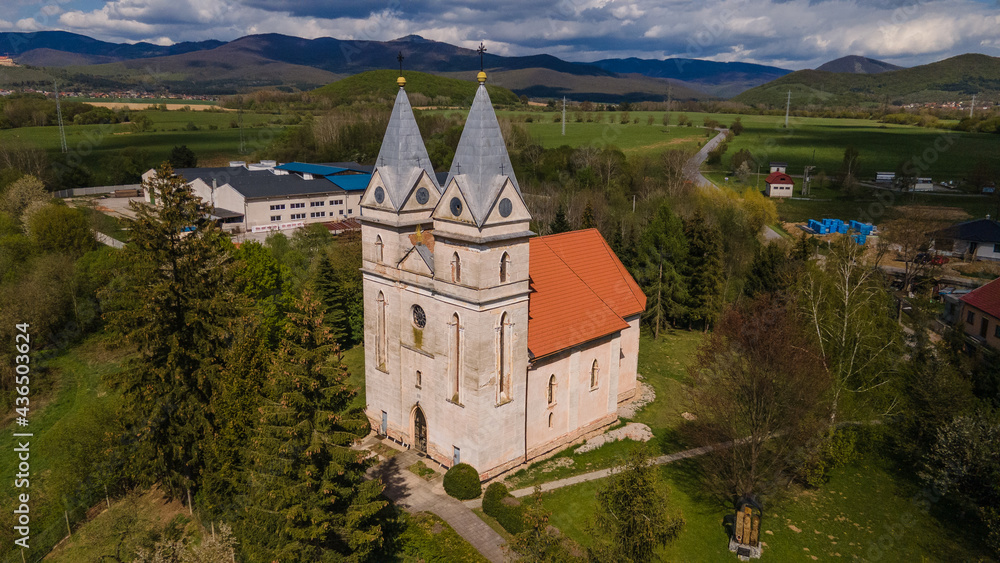 Aerial view of the church in the village of Krasnohorska Dlha Luka in Slovakia Aerial view of the church in the village of Krasnohorska Dlha Luka in Slovakia