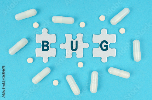 On a blue background, there are pills and puzzles with the inscription - BUG