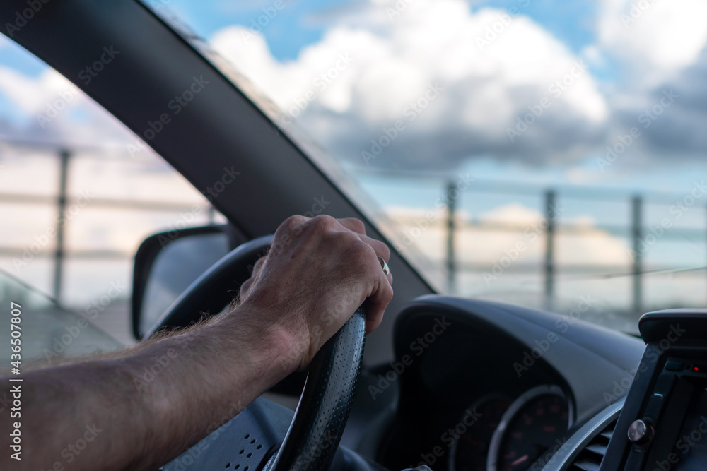 Drive and travel in a car. Blue sky with clouds in the car window. Drive and travel in a car. Blue sky with clouds in the car window.