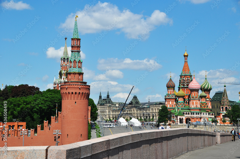 Panoramic view of the tower of the Moscow Kremlin and St. Basil's Cathedral. Moscow, Russia, May 25, 2021. Panoramic view of the tower of the Moscow Kremlin and St. Basil's Cathedral. Moscow, Russia, May 25, 2021.