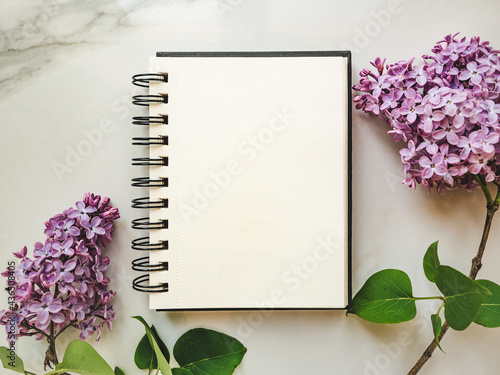 Blank notepad page for your congratulatory message. Closeup, view from above. No people. Concept of preparation for a holiday. Congratulations for relatives, friends and colleagues