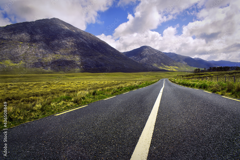 Beautiful landscape scenery of road by the lough inagh with mountains in the background at Connemara National park in county Galway, Ireland