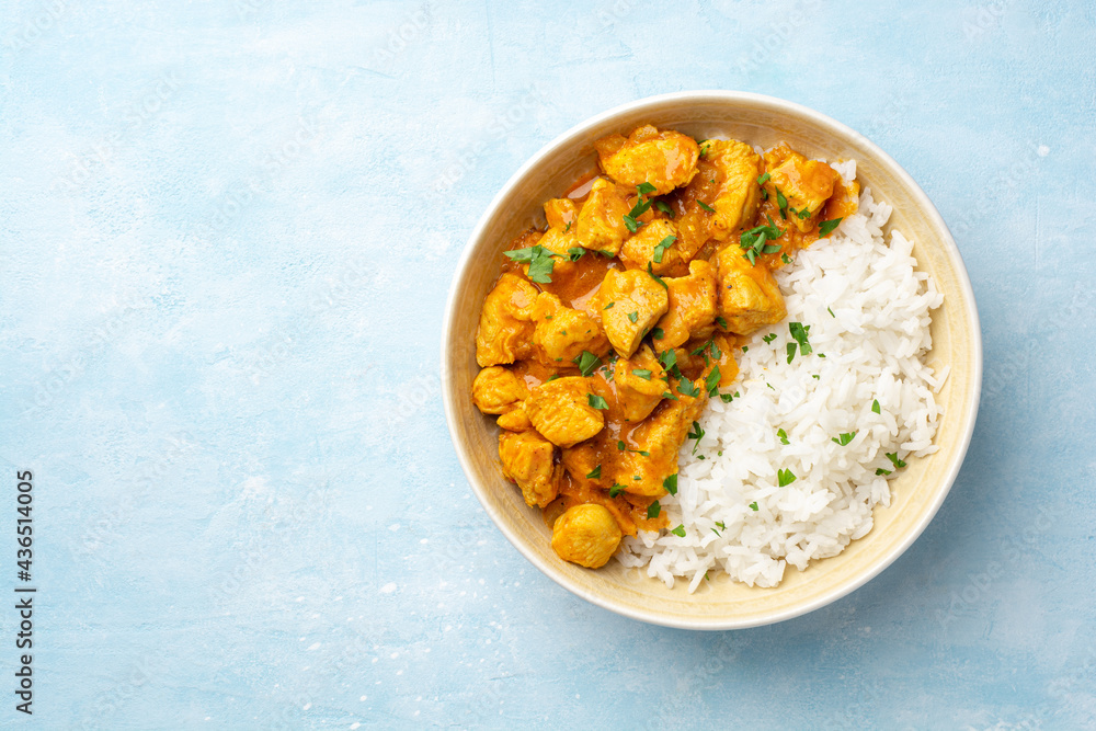 Chicken curry with rice in bowl on concrete background Chicken curry with rice in bowl on concrete background