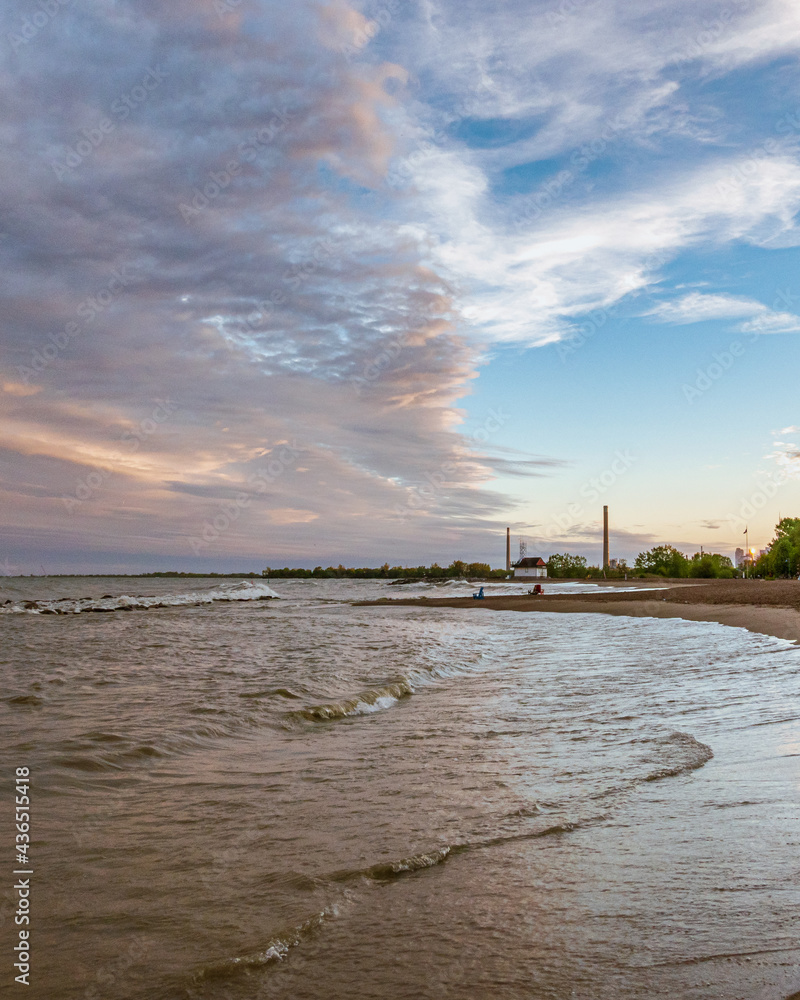 Toronto Beaches sunset with waves breaking on the sand and colorful