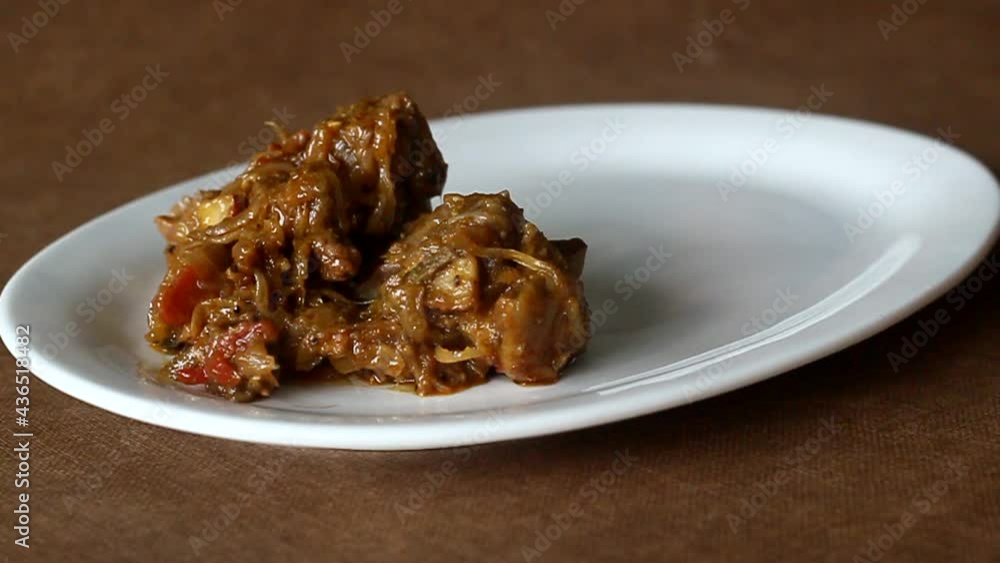 Serving mutton curry prepared in Kerala style with lots of onions and chilly Serving mutton curry prepared in Kerala style with lots of onions and chilly