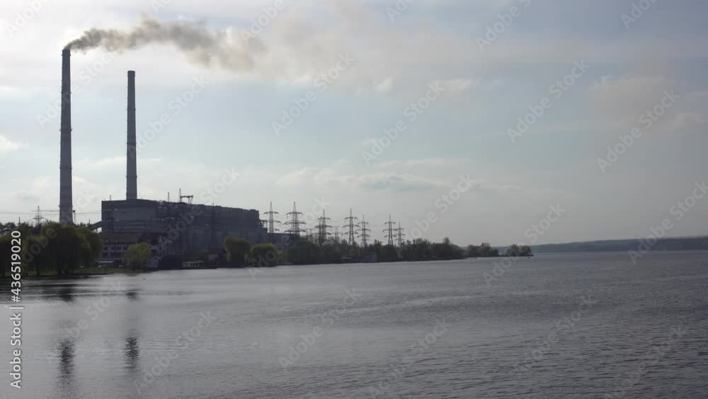 Panoramic view of power station Lukomlskaya Gres. Chimneys with smoke of power plant. Ecological problem. Environmental pollution concept. Panoramic view of power station Lukomlskaya Gres. Chimneys with smoke of power plant. Ecological problem. Environmental pollution concept.