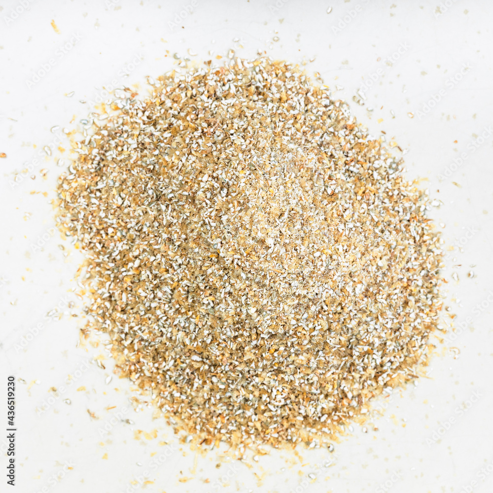 top view of pile of rye bran close up on gray top view of pile of rye bran close up on gray