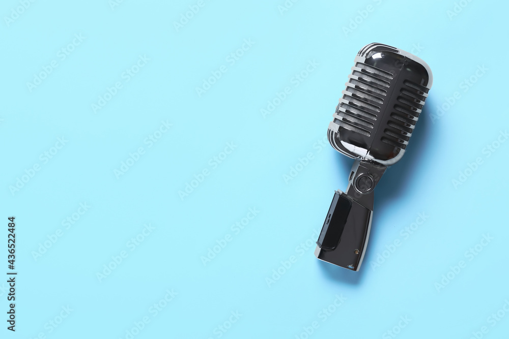 Fototapeta premium Retro microphone on color background