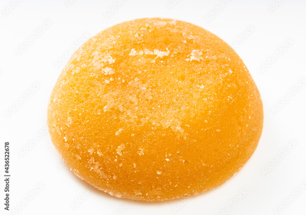 single whole round piece of palm sugar on gray single whole round piece of palm sugar on gray