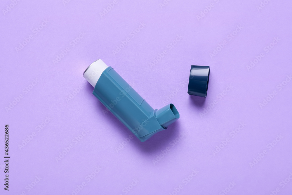 Modern inhaler on color background Modern inhaler on color background