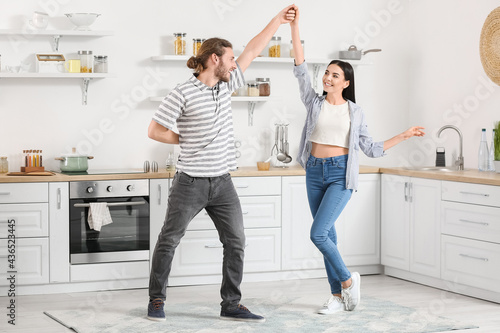 Happy young couple dancing ...