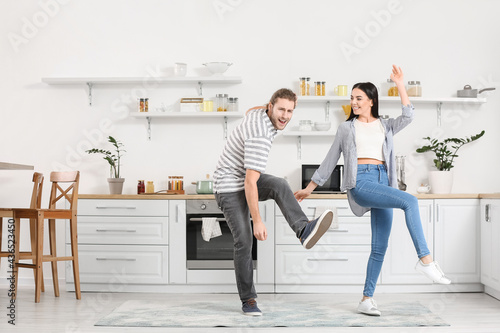 Happy young couple dancing ...
